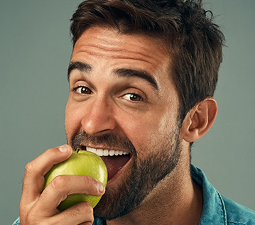 man eating an apple